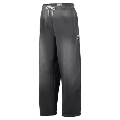 Front view of charcoal Nike Bucks Standard Issue pants with a cream drawcord, Bucks lettering and Nike Swoosh.
