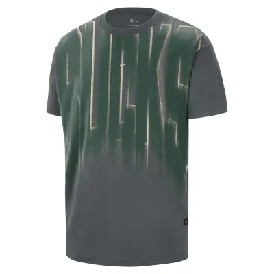 Front view of Iron Grey Nike Bucks Team tee with oversized faded green-and-cream lettering and a center Swoosh.