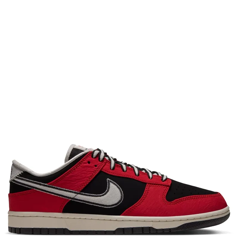 Opposite side view of Nike Dunk Low Retro showing red overlays, embroidered Swoosh and Sail midsole.