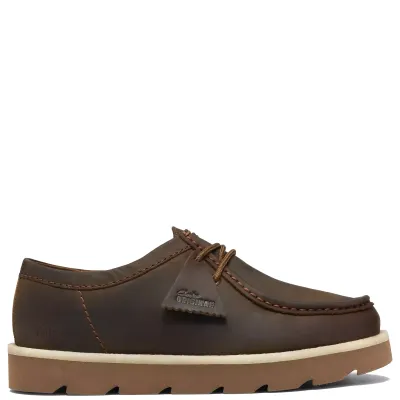 Side view of Clarks Meare Walla in Beeswax leather with apron stitching, a branded fob and contrasting crepe welt.