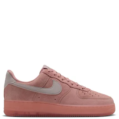 Opposite side view of pink Nike women's Air Force 1 '07 Suede with layered panels and a contrasting Swoosh.