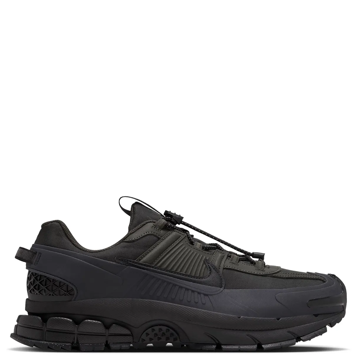 Opposite side view of Nike Zoom Vomero Roam with a tonal Swoosh, toggle laces and heel pull tab.