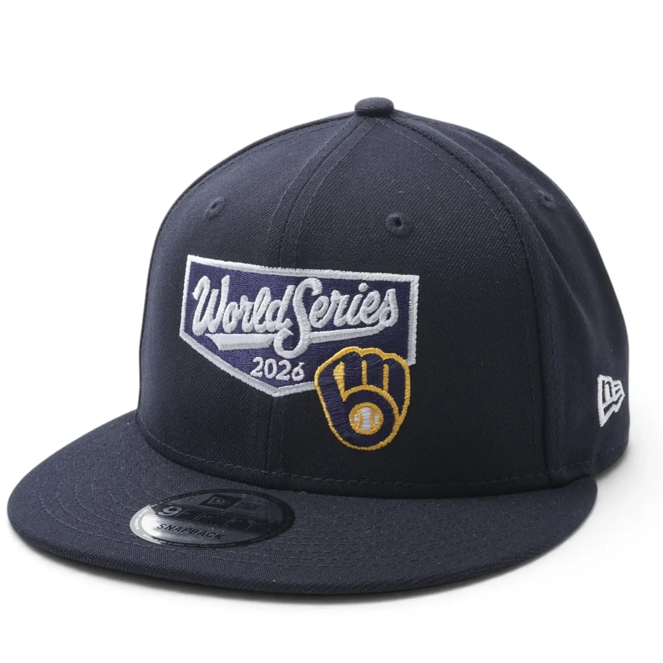 New Era Brewers World Series 9FIFTY navy snapback angled view with embroidered 2026 graphics and team logo.
