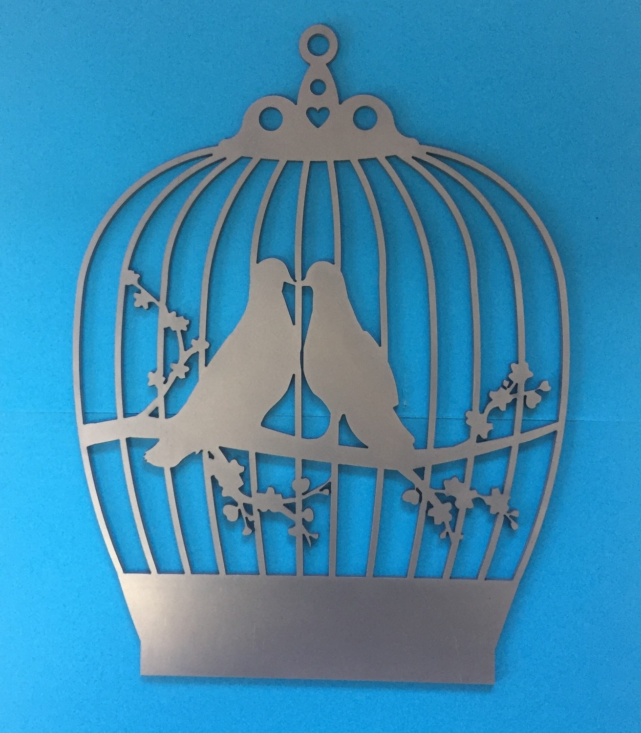 Kissing birds in a cage wall art Kissing birds in a cage wall art