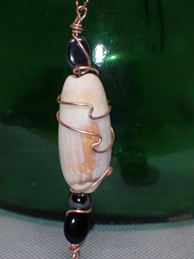 Olive Shell Wrapped in Copper Wire With Wave Accent and Hematite and Iridescent Glass Bead on 16 inch Black Cord Necklace