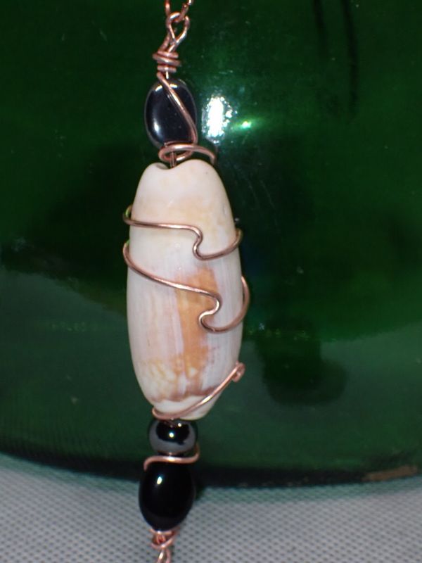 Olive Shell Wrapped in Copper Wire With Wave Accent and Hematite and Iridescent Glass Bead on 16 inch Black Cord Necklace