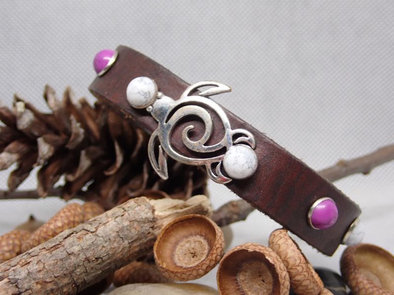 Dark leather bracelet with silver turtle and purple and white stone accents