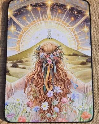Spiritual girl looking towards Glastonbury Tor