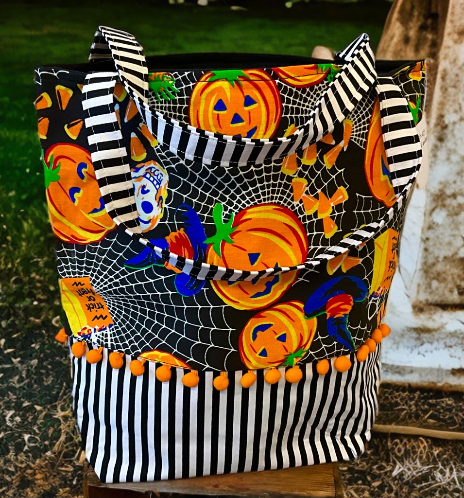 Pumpkin and cobwebs tote bag