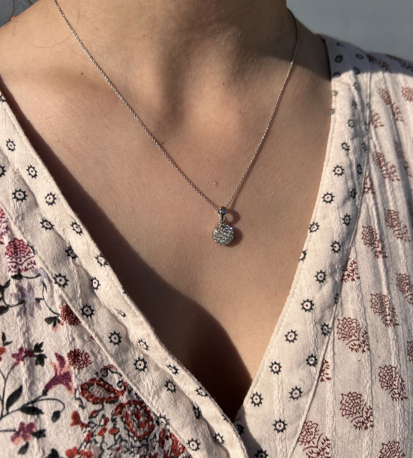 14k white gold dangle pendant w/ .58 CTW round diamonds