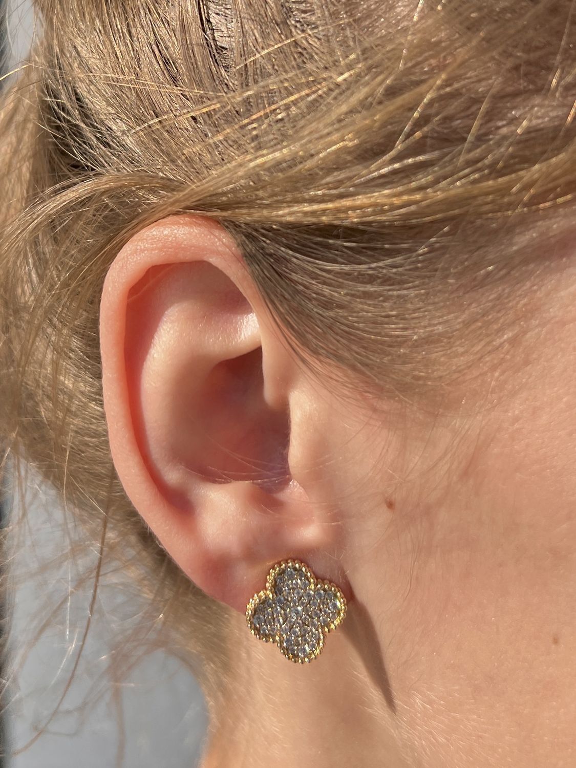 18k yellow gold Van Cleef style earrings with .76 ctw pave set diamonds and omega backs