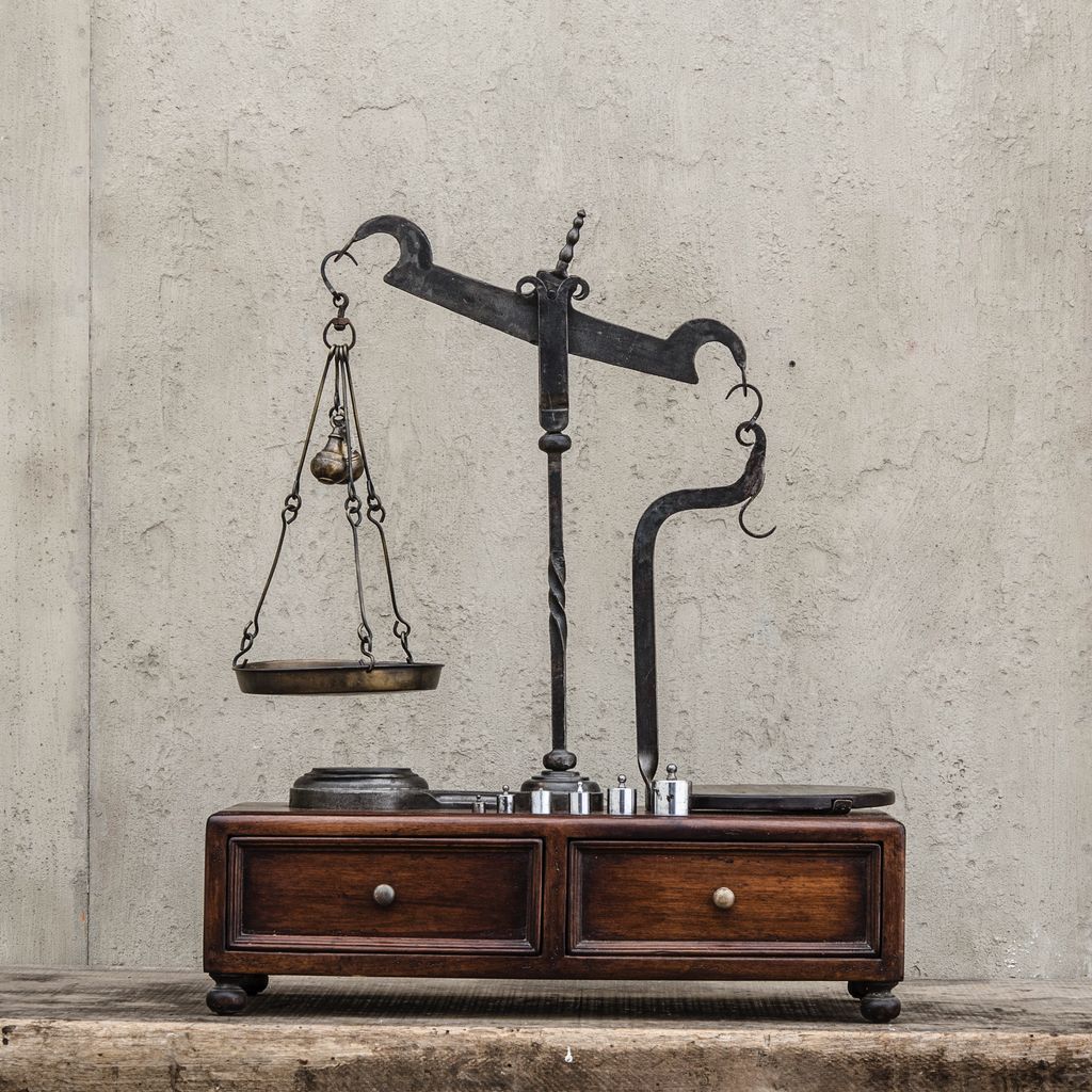 A LARGE ANTIQUE SCALE ON STAND