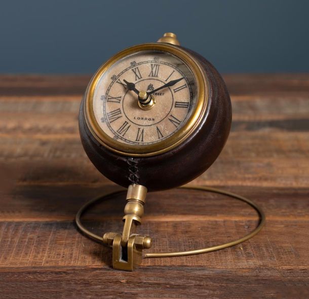 ROUND LEATHER CLOCK ON BRASS STAND
