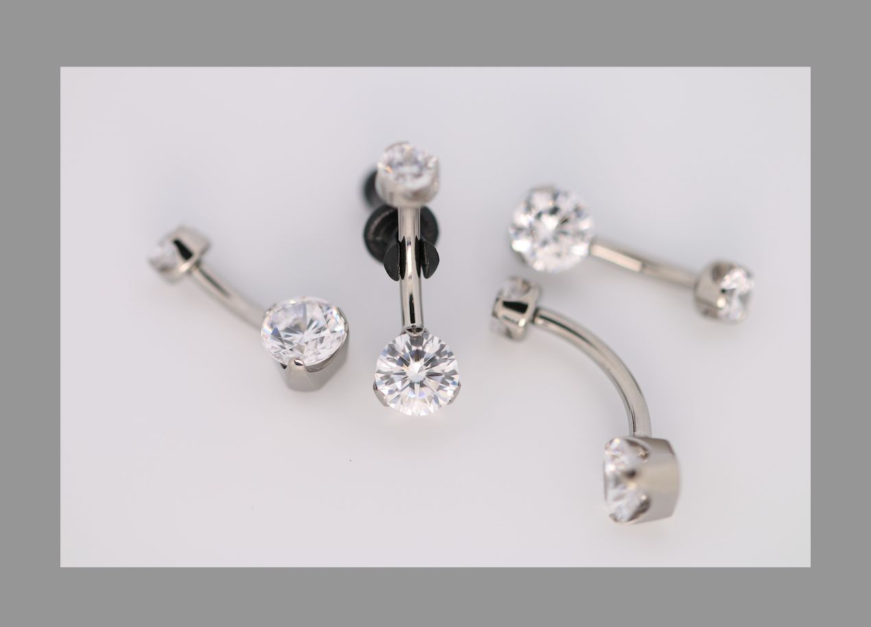 14g 1/2 brilliant cut round cz prong set navel curve