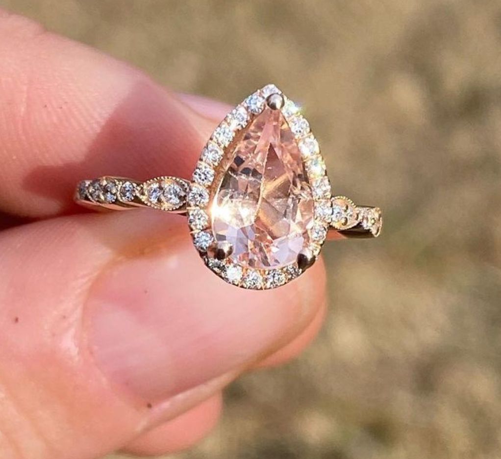 14k rose gold ring featuring a. 1.75ct morganite, with .25ct in shank and halo
