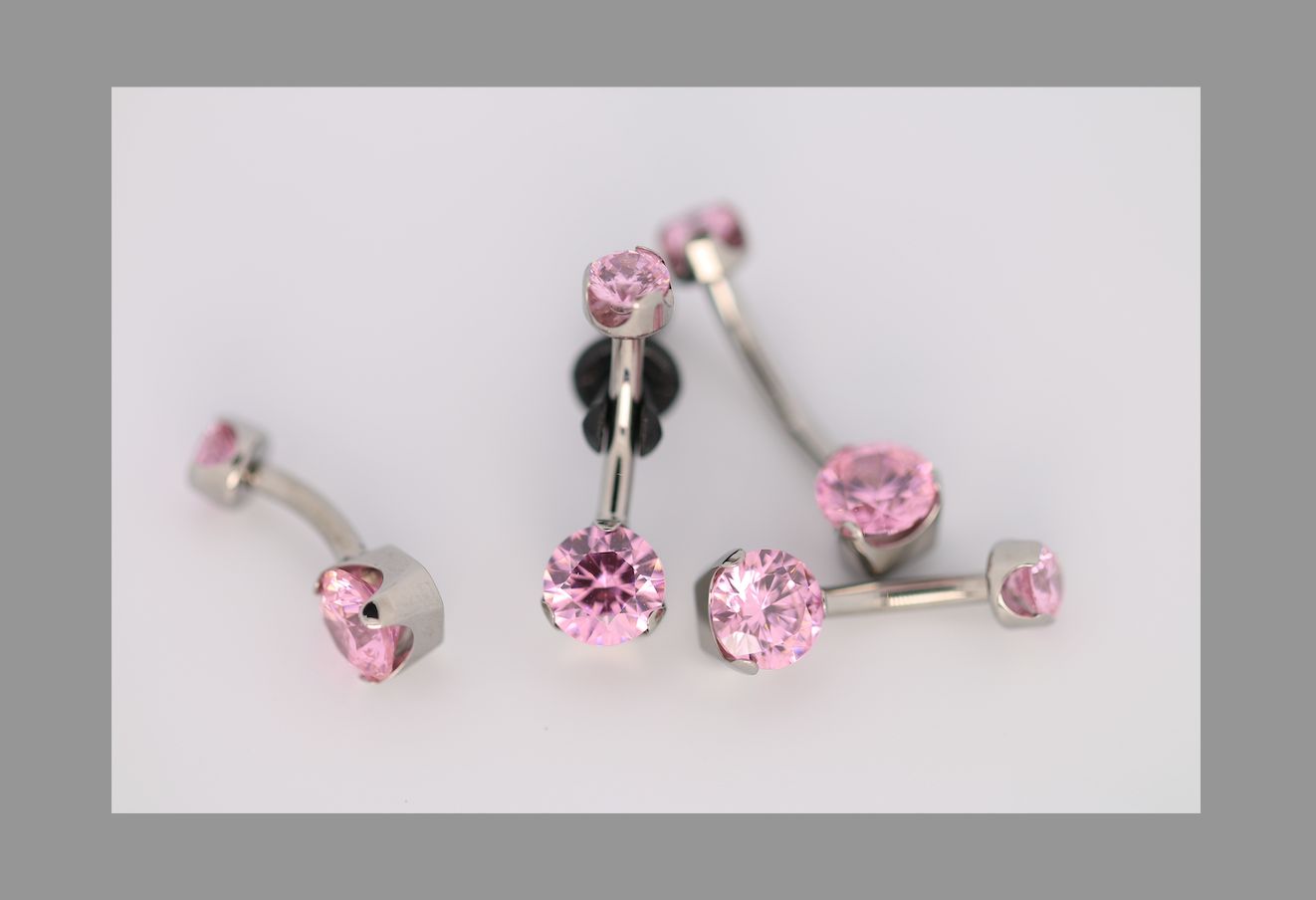 14g 1/2 brilliant cut round pink prong set navel curve