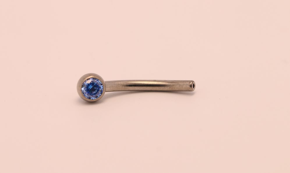 16g 3/8 side gem curved barbell shaft arctic blue cz