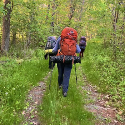 backpacker walking trails in waverly iowa with red backpack 