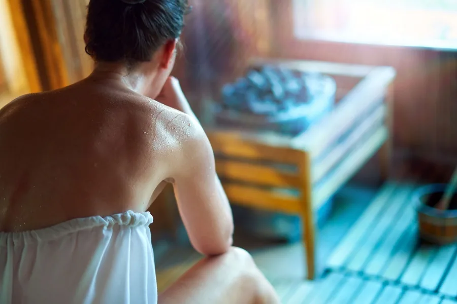 Woman Relaxing in Sauna