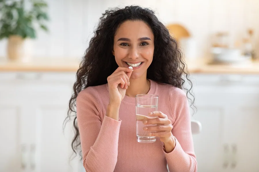 Woman Taking Supplements for Health Woman Taking Supplements for Health