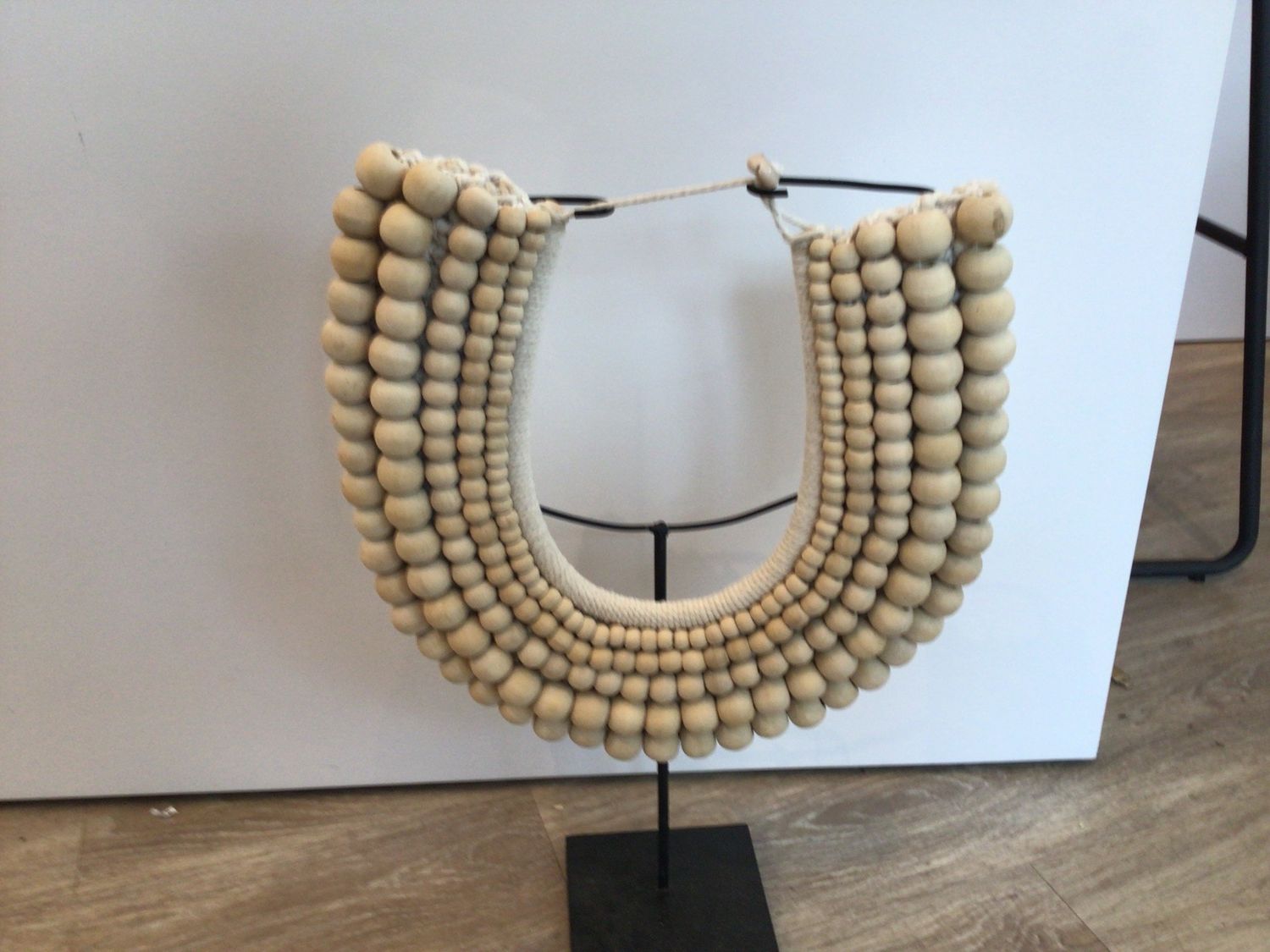 Natural Graduated Beaded Necklace on stand
