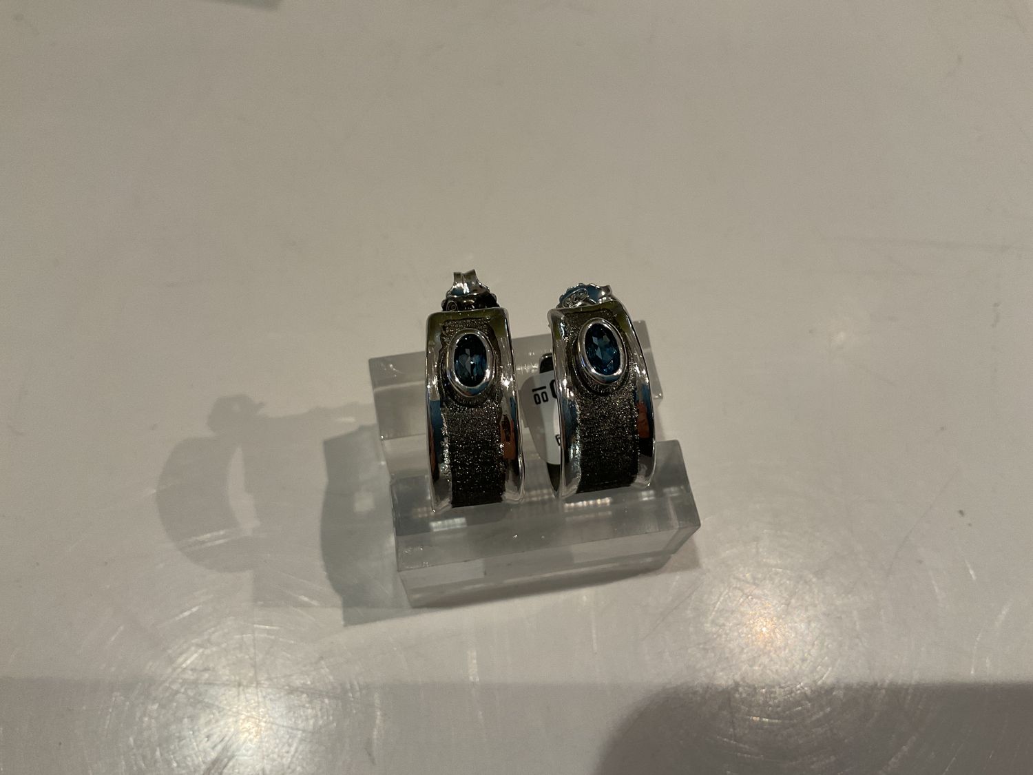 Earrings- Sterling Hoops with .9 CT Oval Blue Topaz