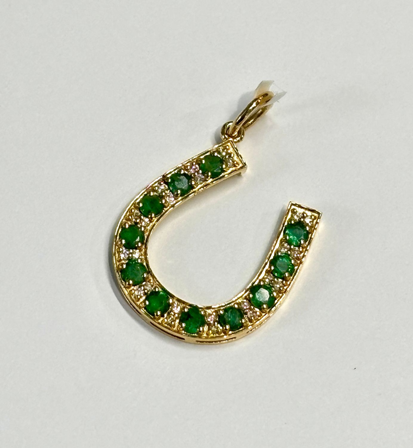 Charm, 14kYG Emerald and Diamond Horseshoe; (1.34 cts)