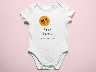 “New Arrival” Orange Badge Baby Grow