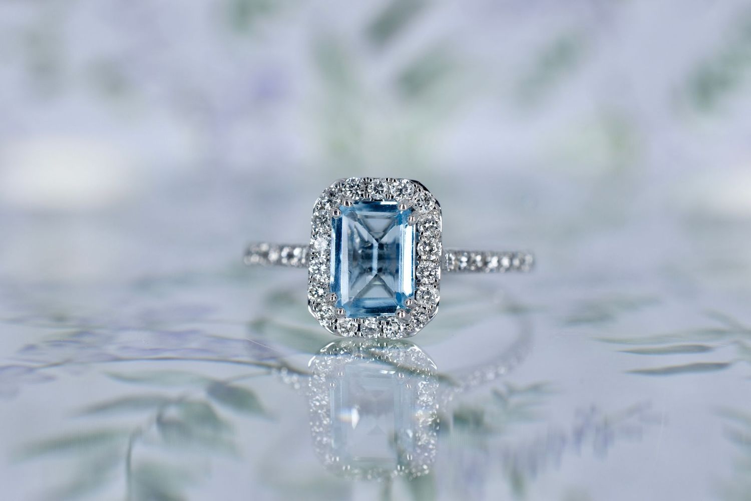 9ct White Gold Emerald cut Aquamarine Halo Cluster Ring with Diamond Shoulders
