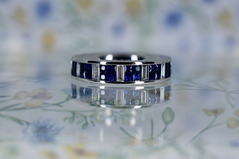 18ct White Gold Princess cut Sapphire and Baguette cut Diamond Eternity Ring