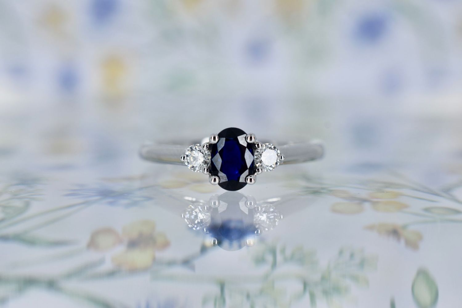Platinum Oval cut Sapphire and Diamond Trilogy Ring