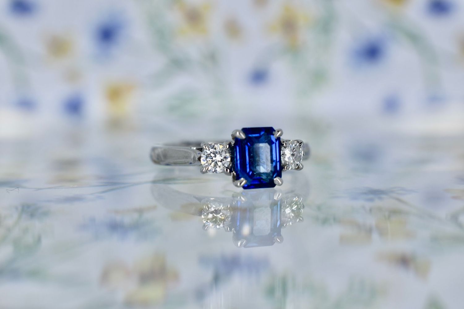 Platinum Emerald cut Sapphire and Diamond Trilogy Ring