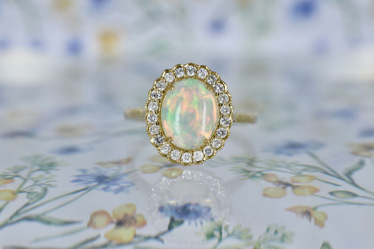 9ct Yellow gold Oval cut Opal and Micro-Claw set diamond Halo Ring