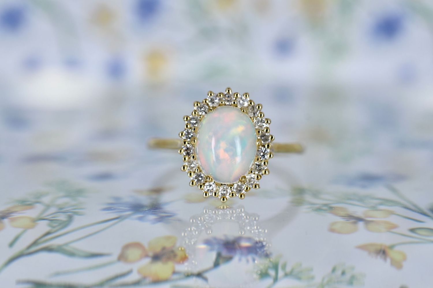 9ct Yellow gold Oval cut Opal and Diamond Halo Cluster ring