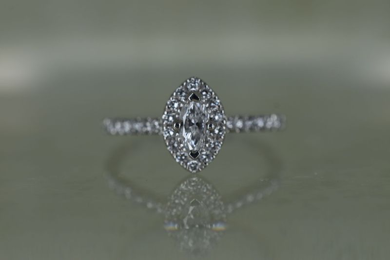 Platinum 0.24ct F SI1 Marquise Cut Diamond Halo Cluster Ring