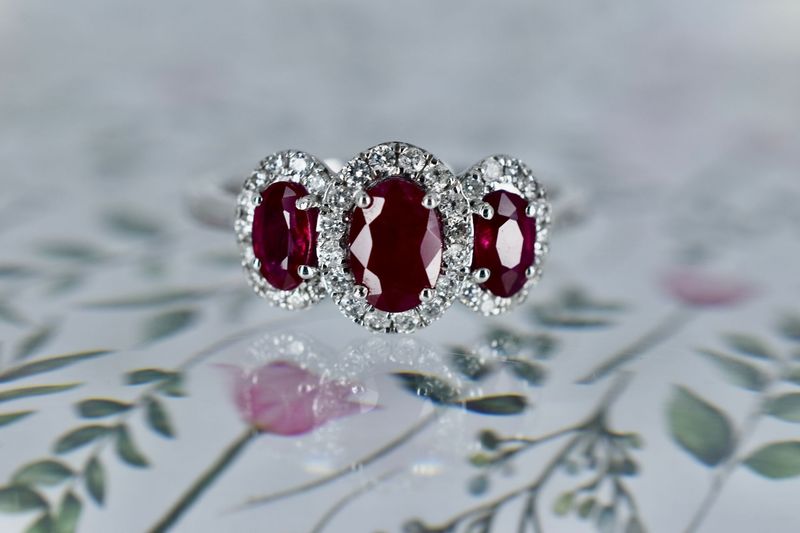 Platinum Oval Ruby & Diamond Triple Halo Cluster Ring