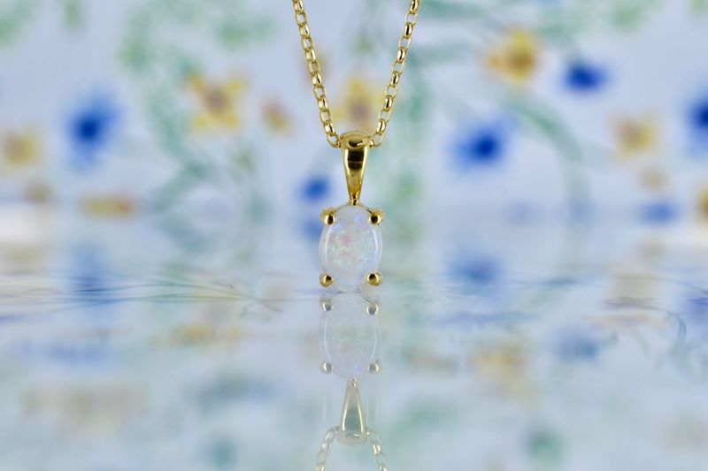18ct Yellow Gold Claw set Oval Opal Pendant on adjustable chain