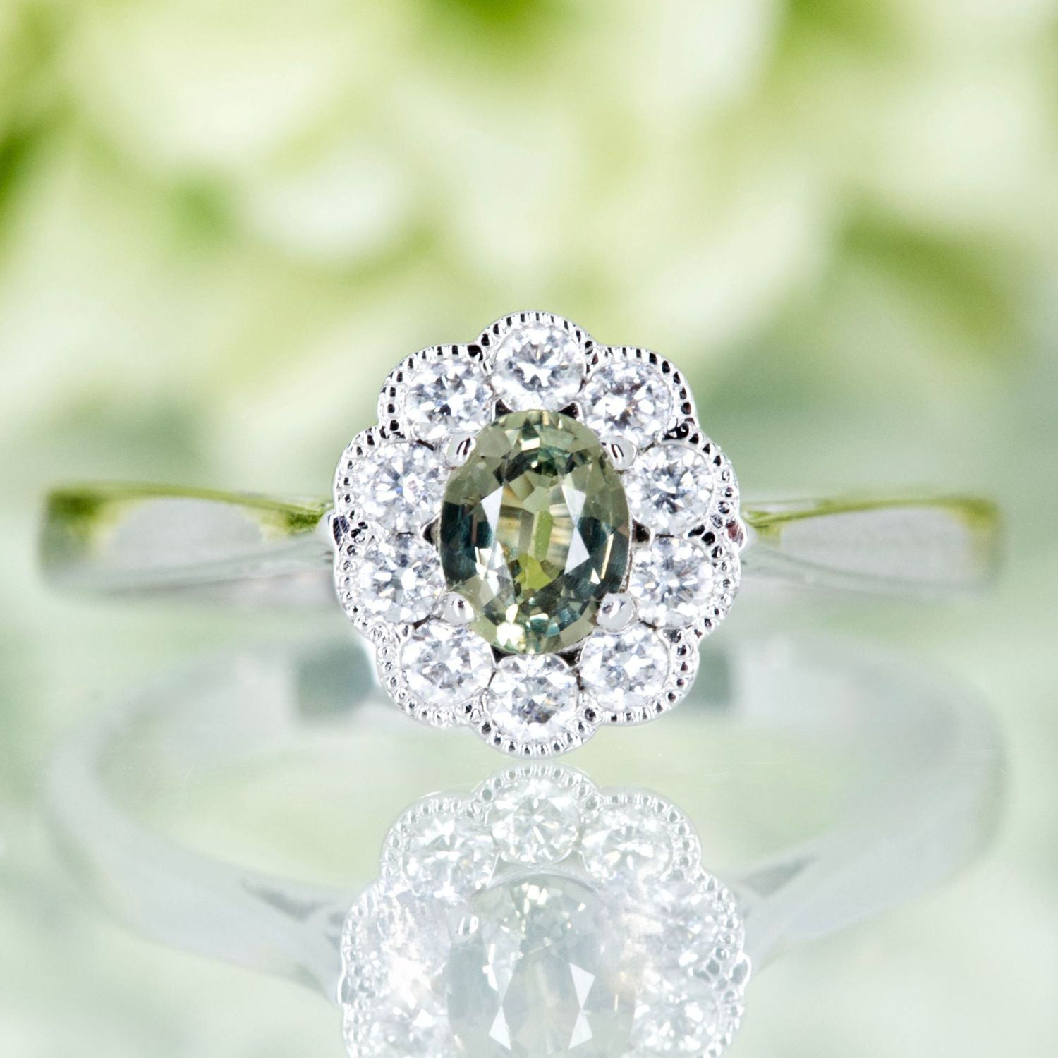 Pre-Loved 18ct White Gold Oval Green Sapphire Vintage Inspired Halo Cluster Ring