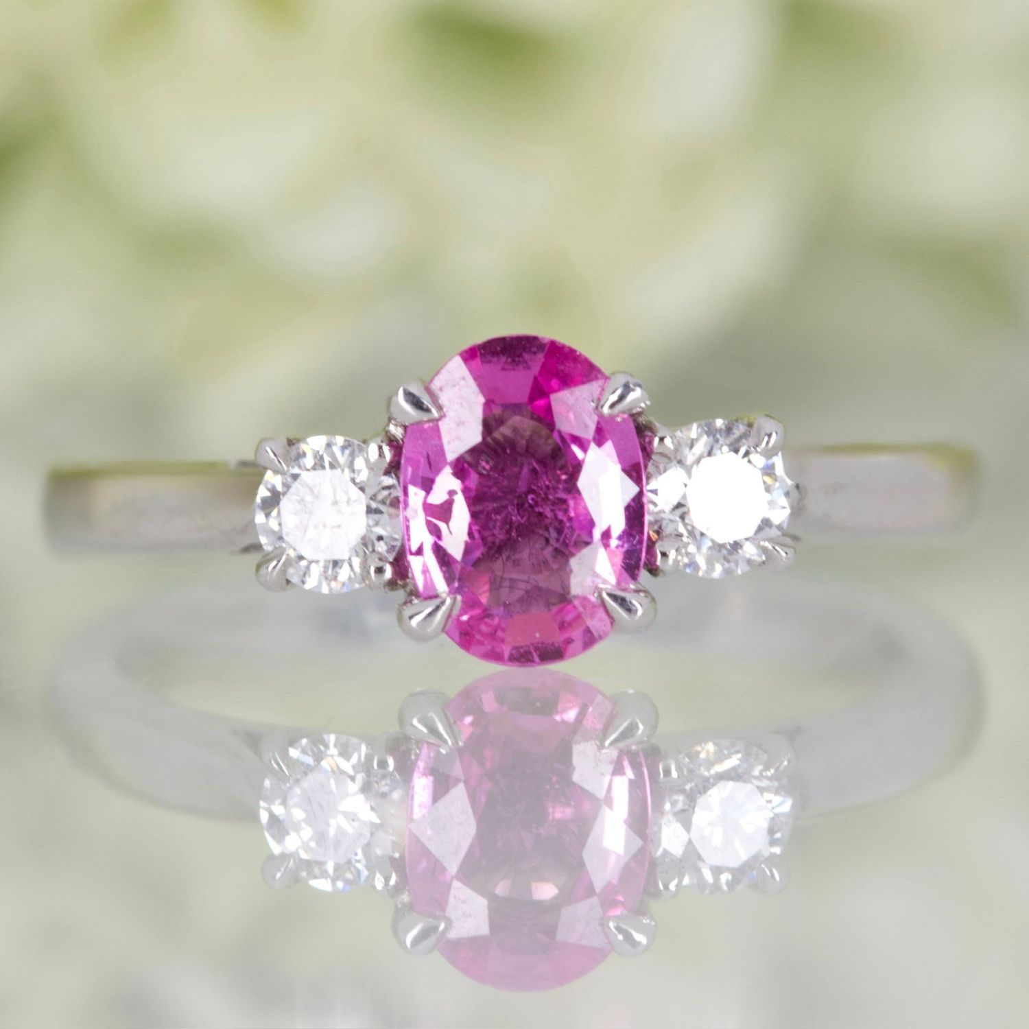 Platinum Oval Cut Pink Sapphire & Round Brilliant Cut Diamond Trilogy Ring