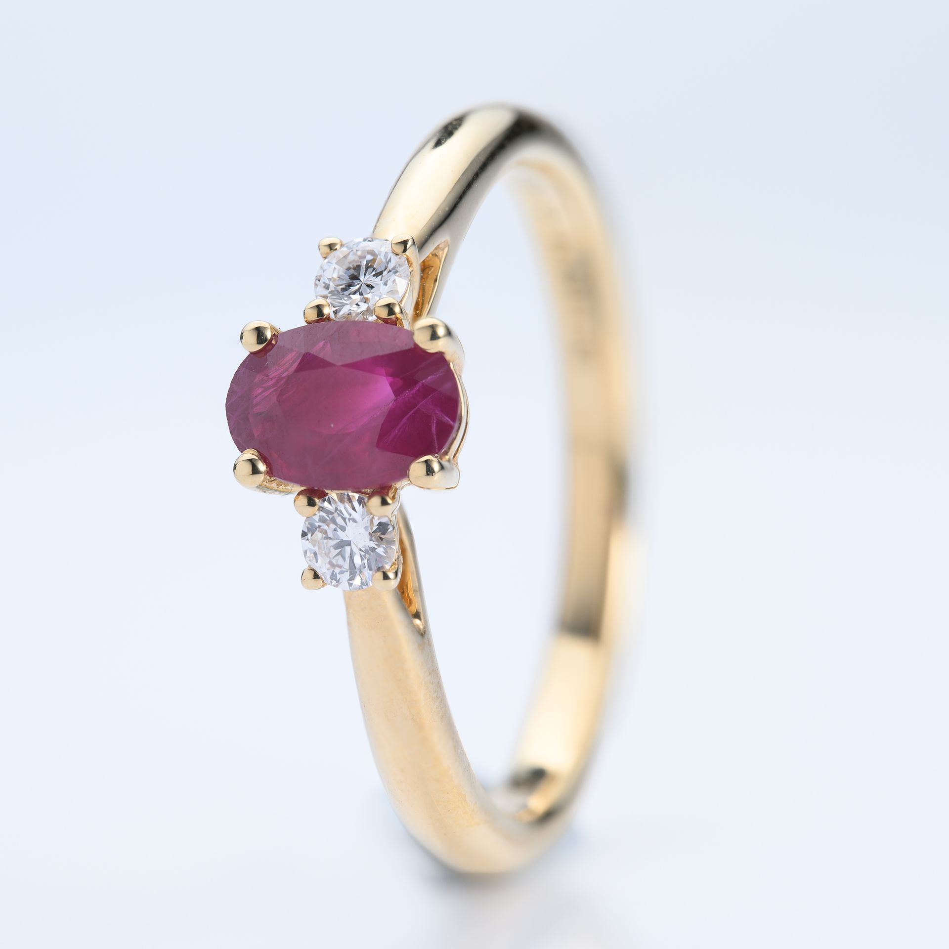 18ct Yellow Gold Oval Cut Ruby & Round Brilliant Cut Diamond Trilogy Ring