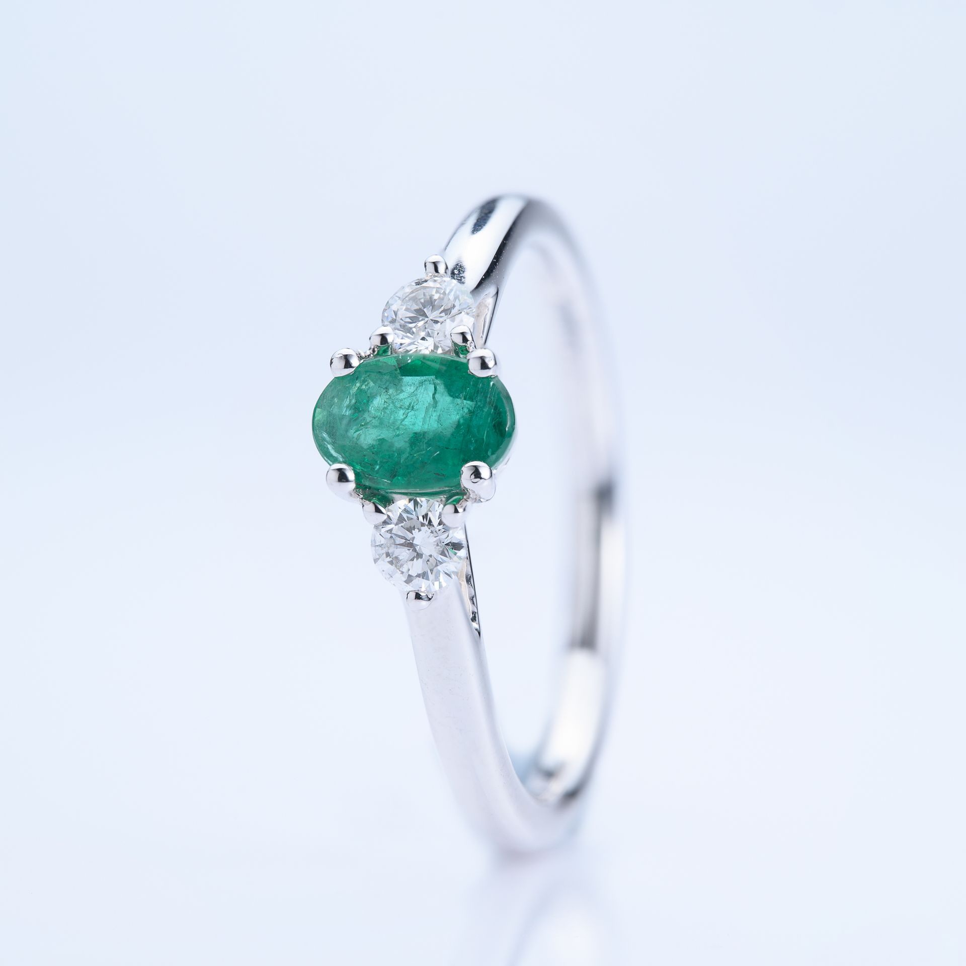 Platinum Oval Cut Emerald & Round Brilliant Cut Diamond Trilogy Ring