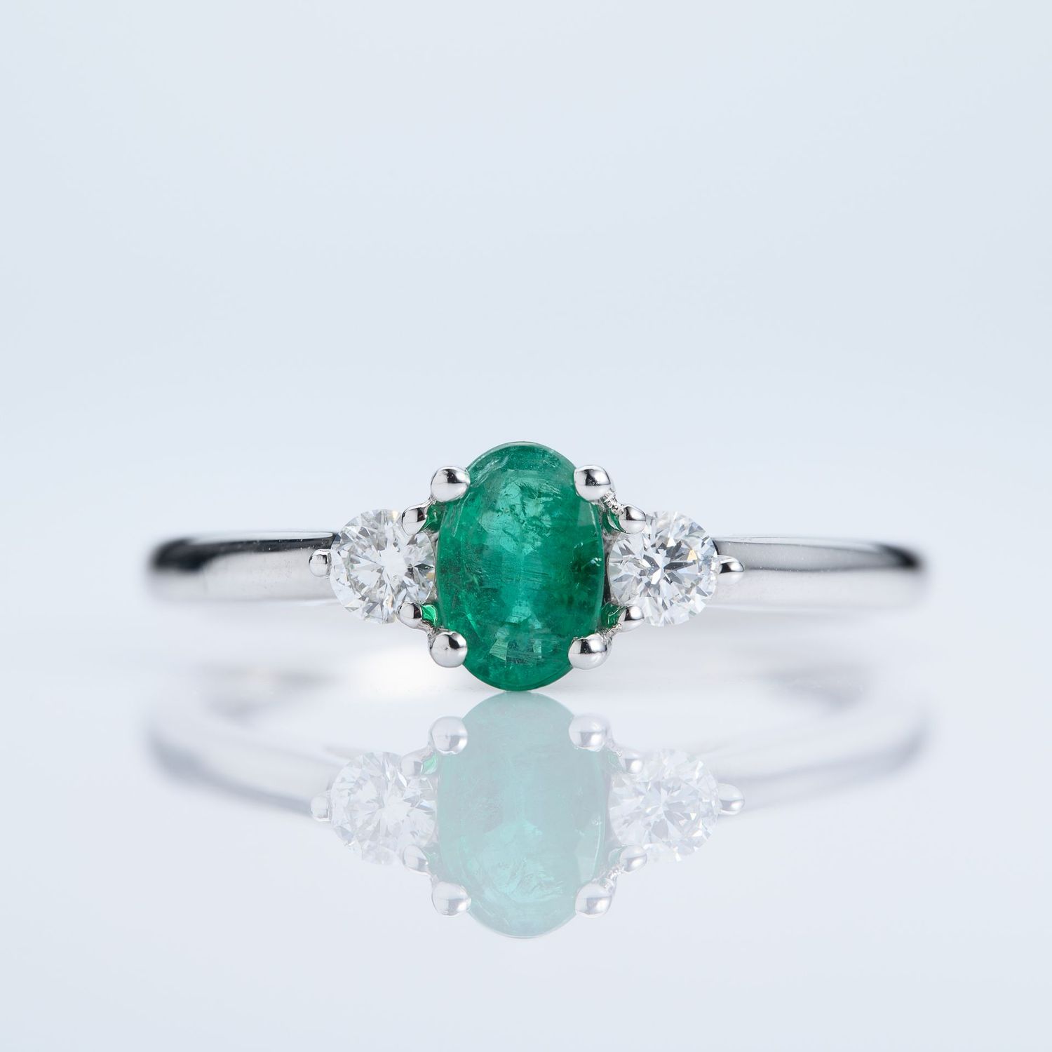 Platinum Oval Cut Emerald & Round Brilliant Cut Diamond Trilogy Ring