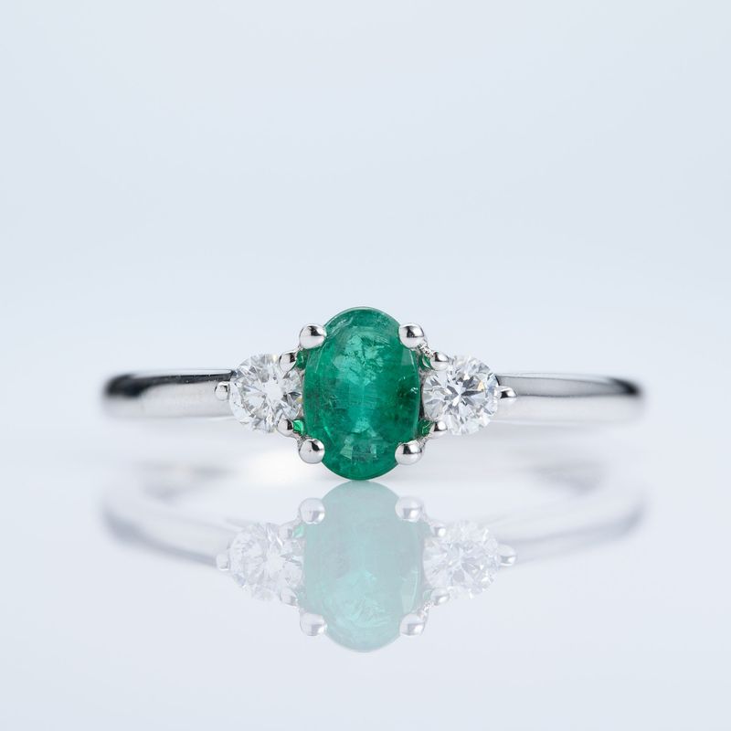 Platinum Oval Cut Emerald & Round Brilliant Cut Diamond Trilogy Ring
