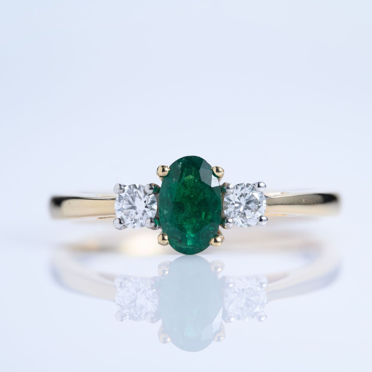 18ct Yellow Gold & Platinum Oval Cut Emerald & Round Brilliant Cut Diamond Trilogy Ring