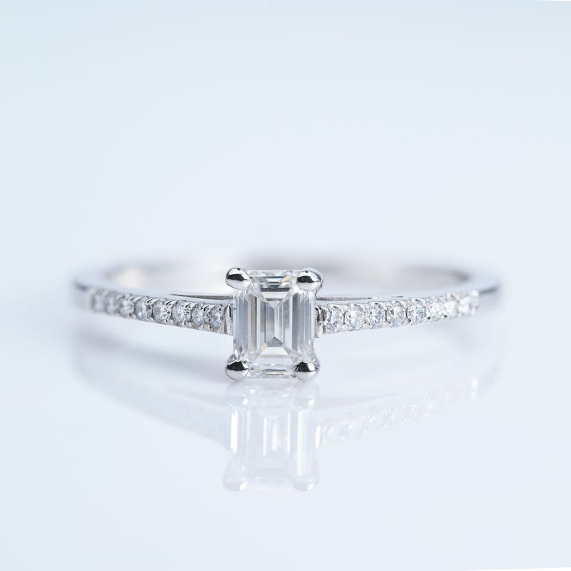 Platinum GIA Certified Emerald Cut Diamond Solitaire Ring with Diamond Set Shoulders