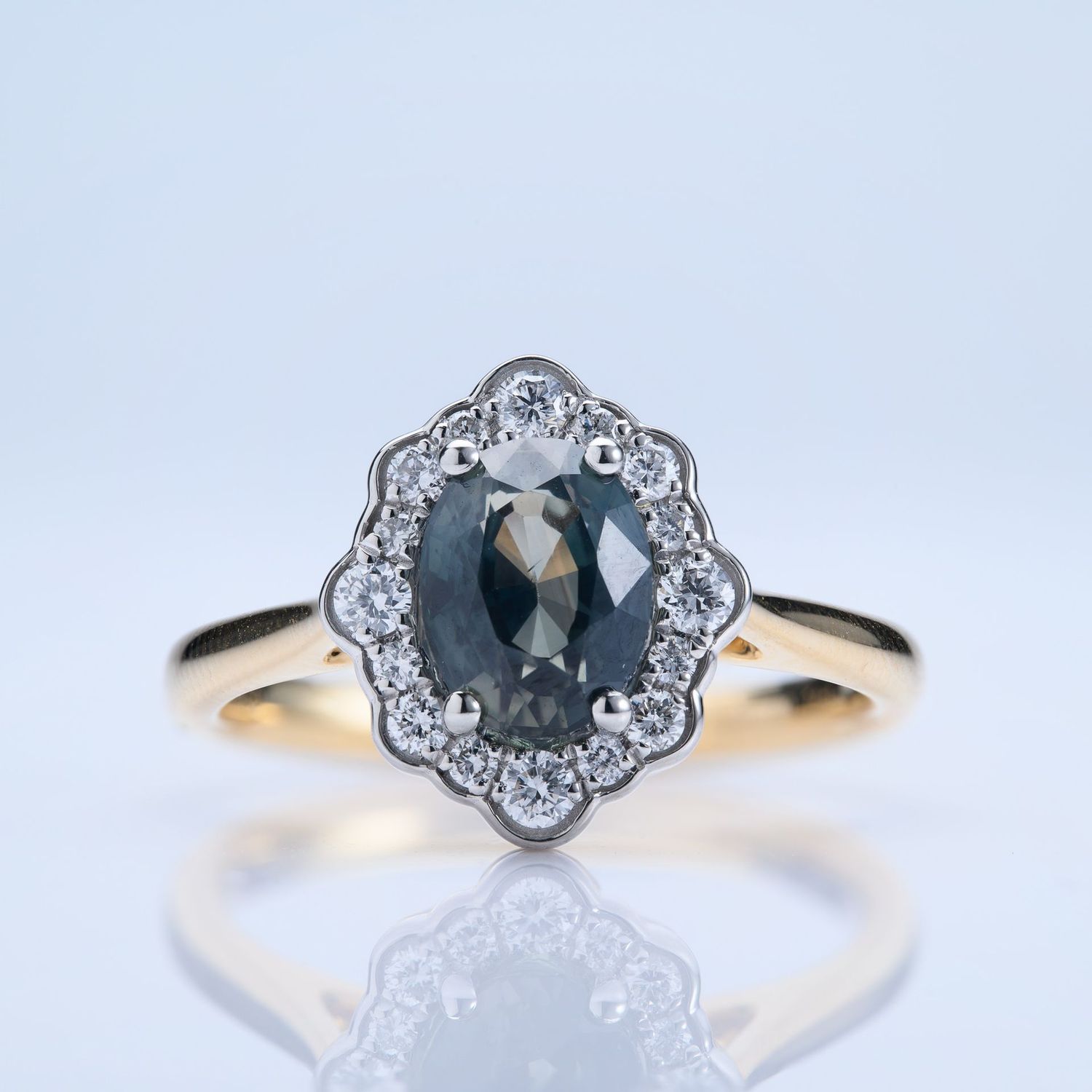 18ct Yellow Gold & Platinum Oval Cut Teal Sapphire & Round Brilliant Cut Diamond Cluster Ring