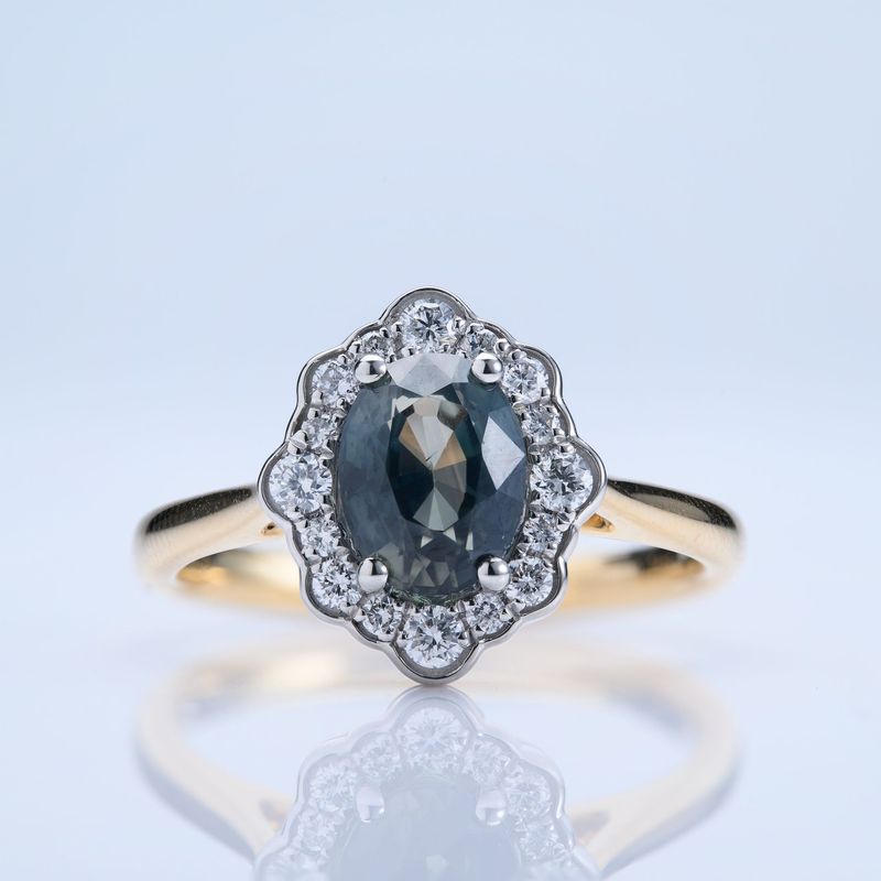 18ct Yellow Gold & Platinum Oval Cut Teal Sapphire & Round Brilliant Cut Diamond Cluster Ring