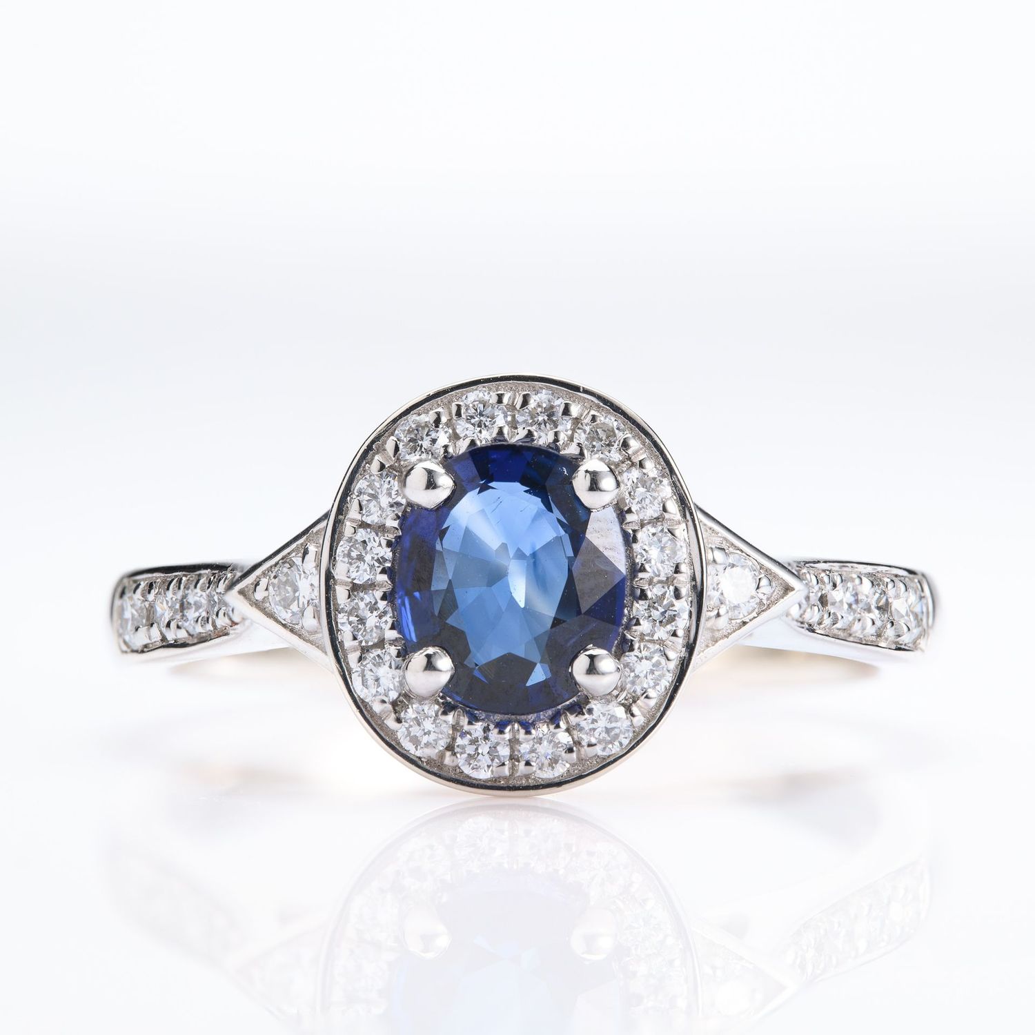 Platinum Oval Cut Sapphire & Round Brilliant Cut Diamond Halo Cluster Ring