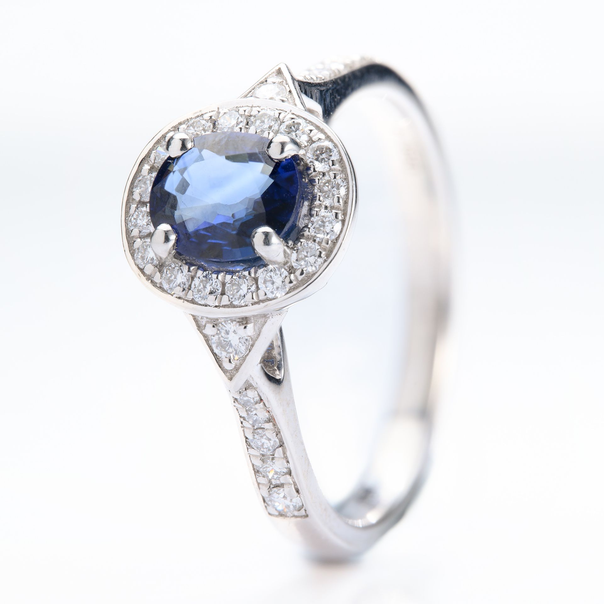 Platinum Oval Cut Sapphire & Round Brilliant Cut Diamond Halo Cluster Ring