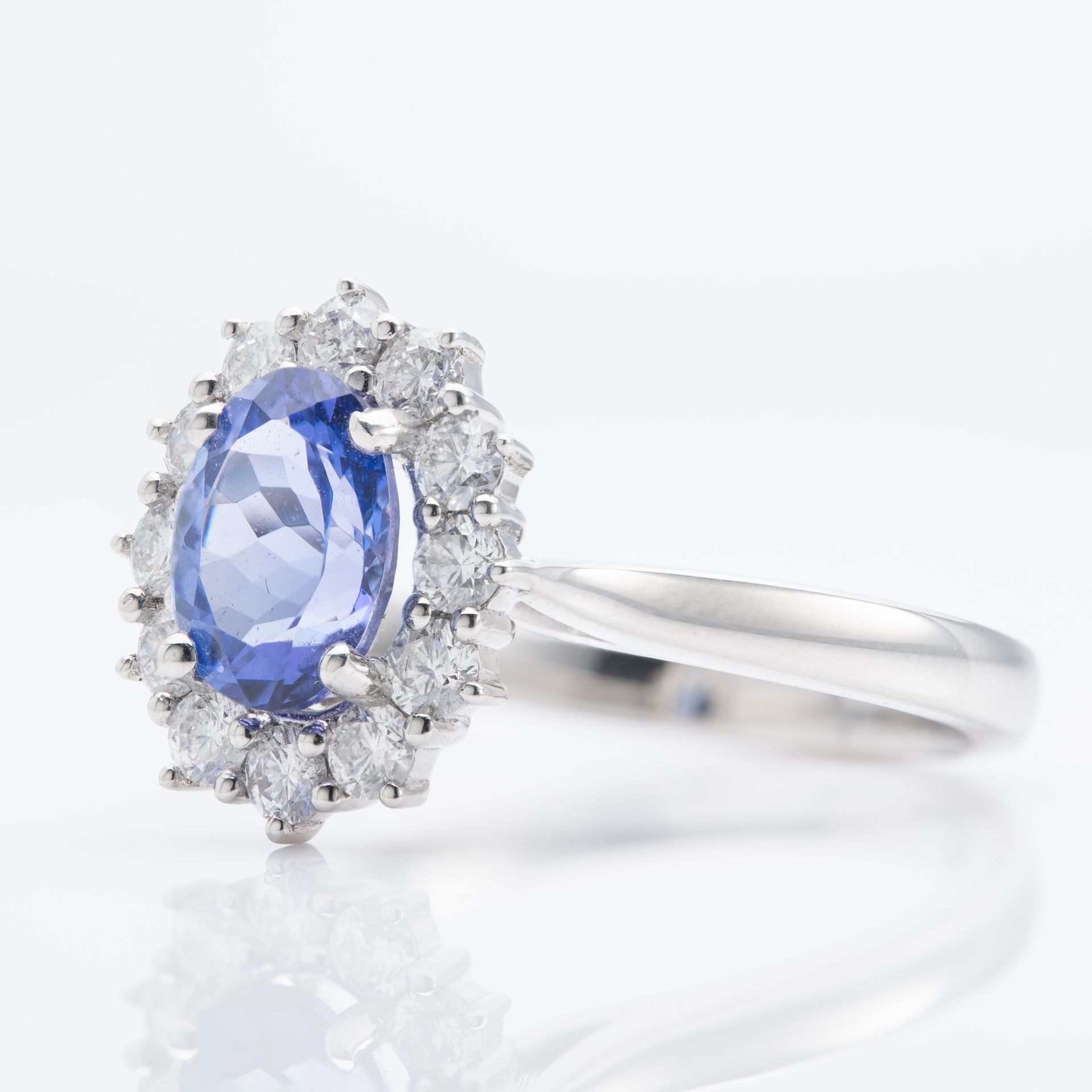 Platinum Oval Cut Tanzanite & Round Brilliant Cut Diamond Cluster Ring